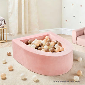 A Tiny Land® PlayNest Ball Pit (Ocean Balls Not Included) by Tiny Land, pink and teardrop-shaped, sits in a kids’ room with pastel and neutral décor, plush bunny, beige curtains, and pastel polka dots. Balls are NOT included.|pink
