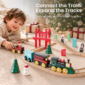 A child plays with a Tiny Land® Christmas Express Wooden Train Accessory Set on a carpeted floor in front of a Christmas tree, with the text Connect the Train. Expand the Tracks. Works with Most Wooden Railways overlaid.