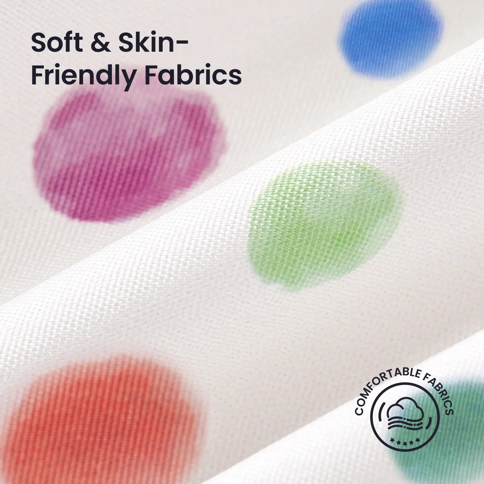 Close-up of Tiny Land® Adventure Play Tunnel’s white fabric with vibrant red, green, blue, and purple polka dots. Features Soft & Skin-Friendly Fabrics with a Comfortable Fabrics icon for playful comfort. Brand: Tiny Land.