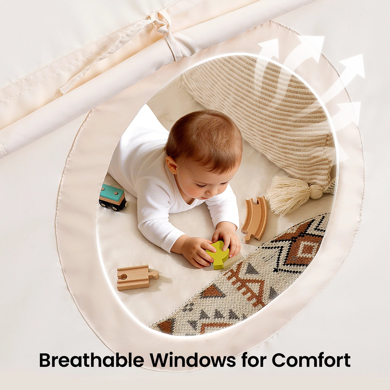 A baby relaxes on patterned cushions inside the Tiny Land® Kids Bed Tent, playing with wooden toys. Seen through a round mesh window, arrows indicate airflow. Text: Breathable Mesh Windows for Comfort by Tiny Land.|Beige