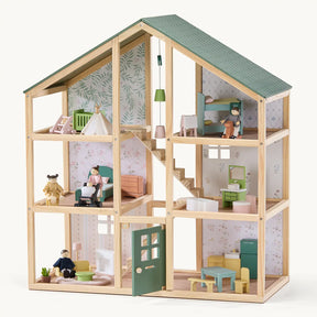 The Tiny Land® Sweetwood Evergreen Dollhouse, by Tiny Land, features a green roof, six rooms, and miniature furniture, offering charming family life details—dolls not included.