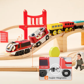 The Tiny Land® Dual-Color Electric Toy Train features a red engine, colorful cars linked by strong magnets, and crosses a bridge—perfect for interactive play. A drawn figure nearby adds to the imaginative experience.|Red