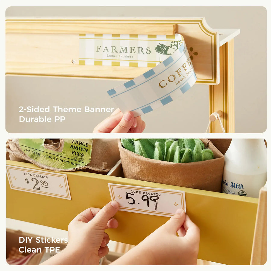 A hand attaches a Tiny Land® banner to a wooden stand and adds a $5.99 sticker to the Tiny Land® Farm-to-Table Gift Set—Light & Sound Kitchen & Market Stall, featuring 2-sided PP banner, DIY stickers, and clean TPE play food.