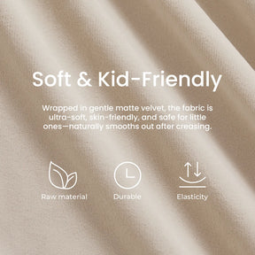 Close-up of the soft beige fabric used in the Tiny Land® GentleSnug Kid Chair, with overlaying text highlighting its softness, kid- and skin-friendly qualities, durability, and elasticity—crafted from premium raw materials. Part of the Tiny Land foldable kids sofa collection, this chair features high-density foam to provide exceptional comfort and support. Three illustrative icons symbolize its quality raw materials, lasting durability, and stretchable elasticity.|Beige