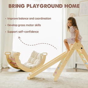 A young girl smiles atop a wooden indoor slide next to the Tiny Land® Pikler Triangle 7-in-1 Montessori Climbing Set. Soft cushions provide comfort as she improves balance, develops motor skills, and builds self-confidence. Brand: Tiny Land.