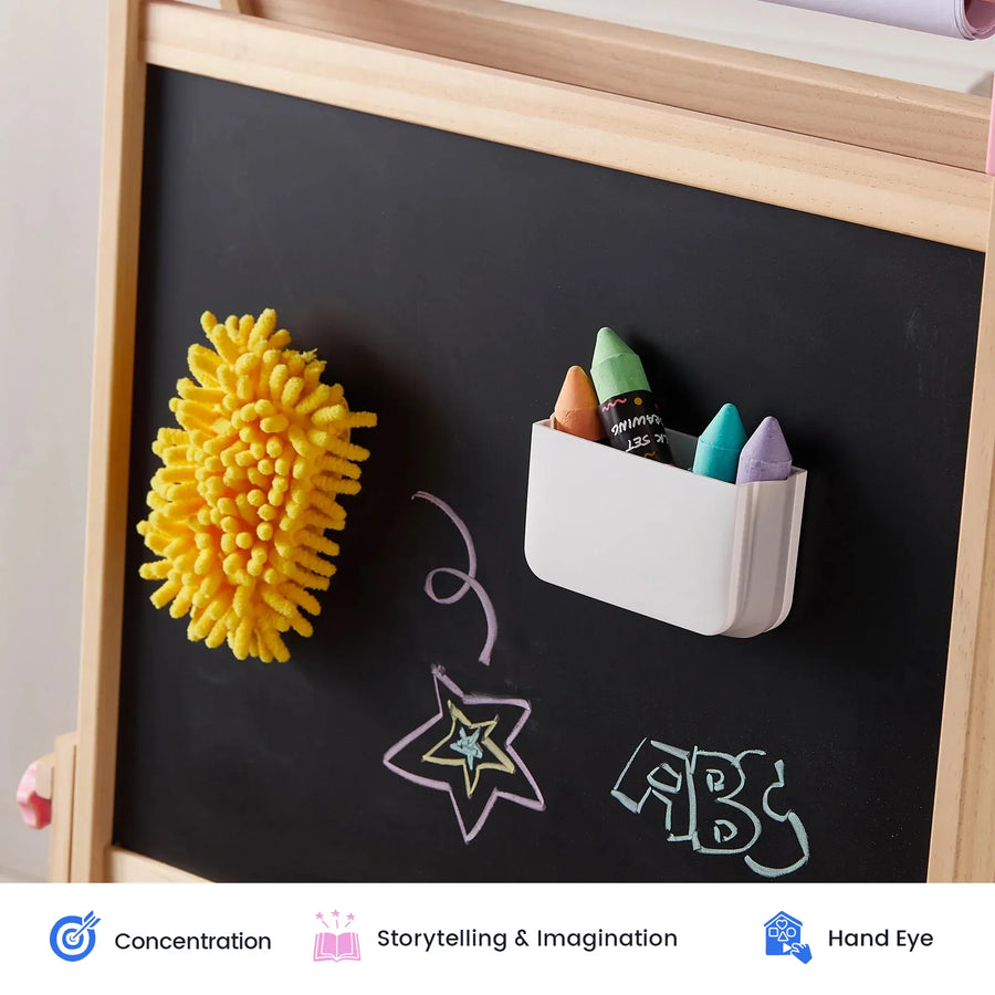 The Tiny Land® Magnitales Easel Art Kit by Tiny Land features a chalkboard with colorful chalk sticks in a white holder, a yellow duster attached, and playful drawings of a star, spiral, and “ABC” on the board. Designed to inspire creativity as part of an easel accessory kit or as an art gift set for kids, this whiteboard and chalkboard set encourages concentration, storytelling, and hand-eye coordination skills—icons below illustrate these benefits.