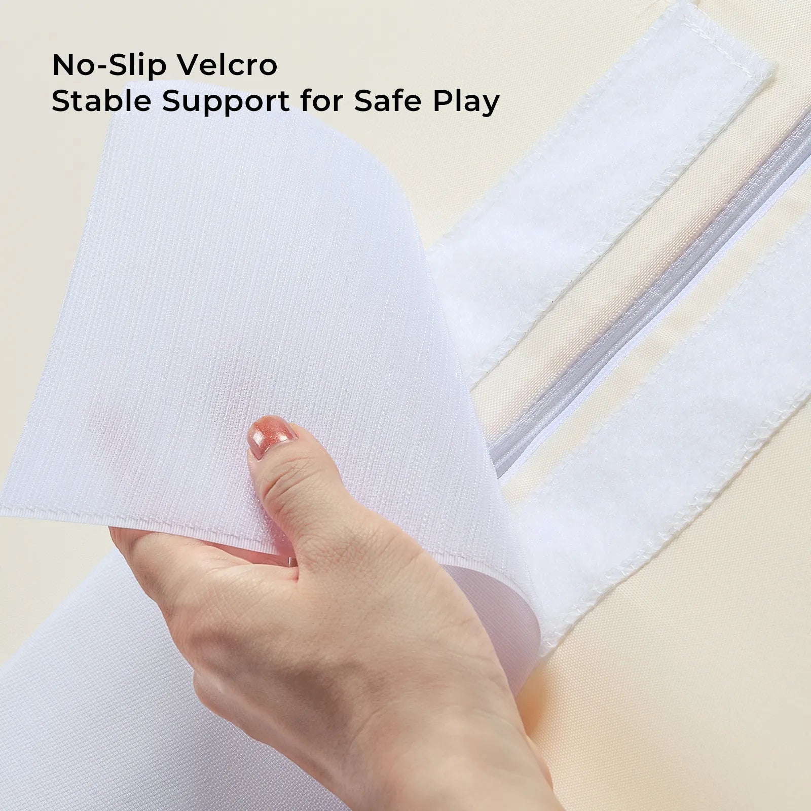 A hand peels back white Velcro on Tiny Land® PlayNest Climbing Blocks, revealing the gripping side. Text above: No-Slip Velcro. Stable Support for Safe Play. The background is a light, neutral color. Brand: Tiny Land.