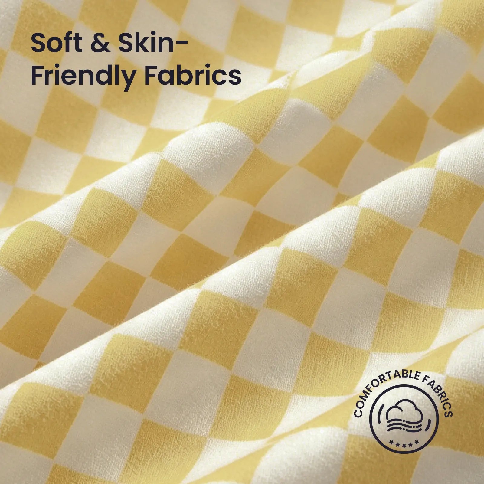 Close-up of the Tiny Land® Tiny Sunshine Castle Tent’s yellow and white checkered, soft fabric—ideal for kids. Text reads “Soft & Skin-Friendly Fabrics” and “Comfortable Fabrics” with a cloud and leaf icon. Brand: Tiny Land.