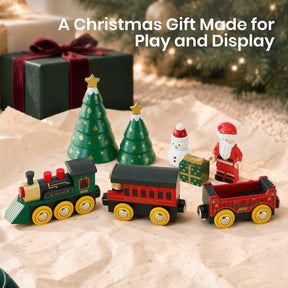 Tiny Land® Christmas Express Wooden Train Accessory Set featuring a green engine, a red passenger car, a red cargo car, two Christmas tree figures, a snowman, a Santa Claus figure, and a small gift box.