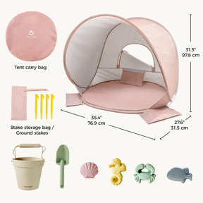 The Tiny Land® One-Stop Beach Toy & Tent Set – Blush Pink includes a UV-protective tent, carry bag, four yellow stakes with storage bag, beige bucket, green shovel, and five sea-themed sand molds—displayed with measurements.
