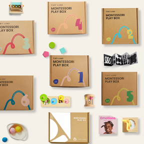 Flat lay of Tiny Land® Montessori Complete Baby Set (0-24 Months) by Tiny Land, featuring brown boxes, colorful toys, rainbow stacker, wooden rattles, felt balls, picture cards, and sensory play items for motor skill development on a beige background.