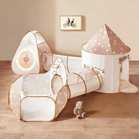 Tiny Land® Discovery 5-in-1 Play Tunnel Set by Tiny Land includes tunnels, a ball pit with target, round tent, and triangular tent. Star patterns decorate the set; teddy bear and wall art create a playful scene (balls not included).