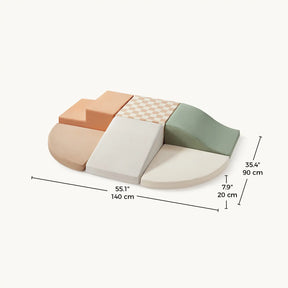 The Tiny Land® PlayNest Climbing Blocks by Tiny Land INC include six foam pieces in muted tones on a rounded mat with a step, ramp, and checkerboard pattern. Ideal for toddlers' gross motor skills. Size: 140 x 90 x 20 cm.