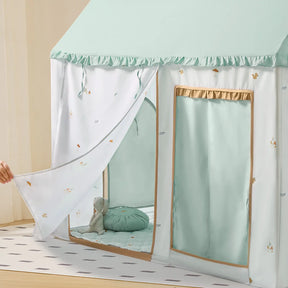 The Tiny Land® Sweet Woodland Kids Play Tent by Tiny Land INC features a pastel blue and white fabric, an open front flap, and a plush bunny on a floor cushion. A hand pulls back the curtain, inviting play in this cozy indoor hideaway.