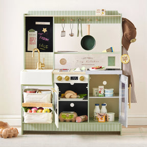 The Tiny Land® BistroSwitch Play Kitchen by Tiny Land includes green tiles, gold faucet, stove, utensils, play food, grocery baskets, chalkboard, chef’s hat, apron & a stocked fridge—perfect for imaginative kids’ kitchen adventures.|Green