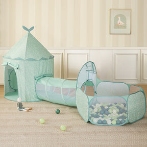 The Tiny Land® Adventure 3-in-1 Play Tunnel & Ocean Ball Set - Green by Tiny Land, featuring a play tent, tunnel, and ball pit with colorful balls, is arranged on a beige carpet with a plush bunny toy and scattered balls in the softly decorated room.