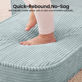 A child’s foot presses into the soft, ribbed, light blue cushion of the Tiny Land® GentleSnug Corduroy Kid Chair. This cozy chair from Tiny Land features a quick-rebound, no-sag cushion and is crafted from kid-friendly matte velvet that feels gentle on skin and maintains a smooth appearance.|Soft Teal