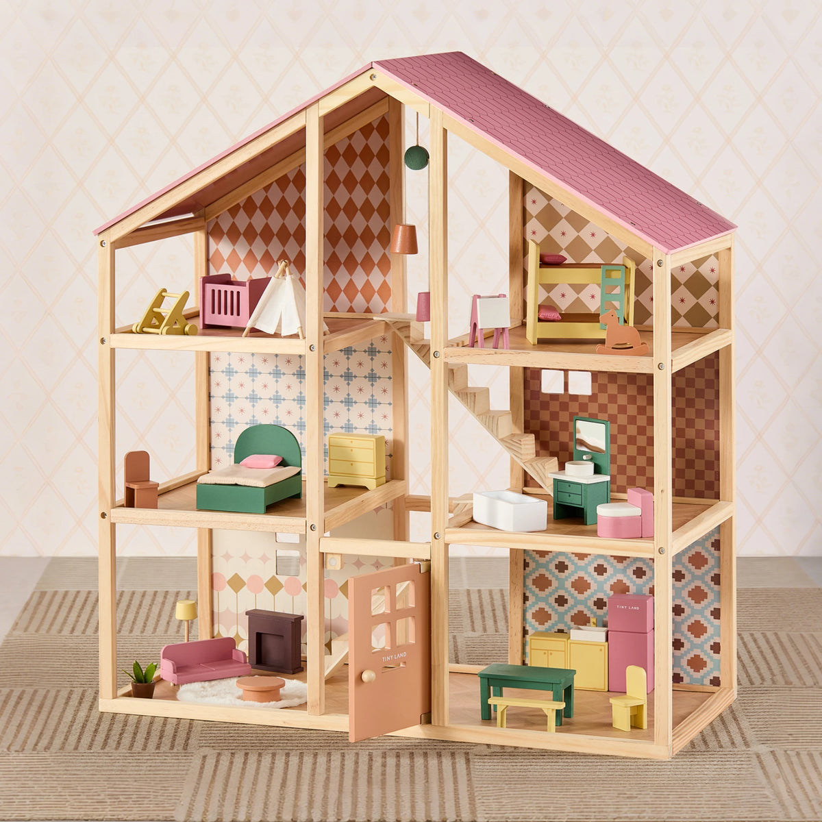 The Tiny Land® Sweetwood Pegasus Dollhouse features six rooms, patterned wallpaper, colorful furniture, an open front, and includes poseable family dolls for imaginative play in every room.