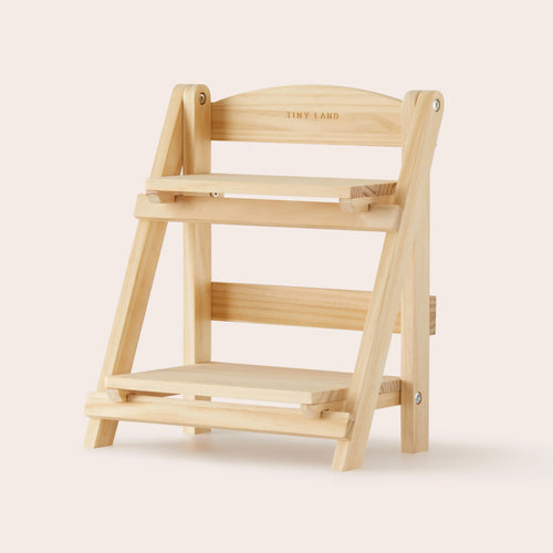 A compact, light wood two-tier display shelf with 