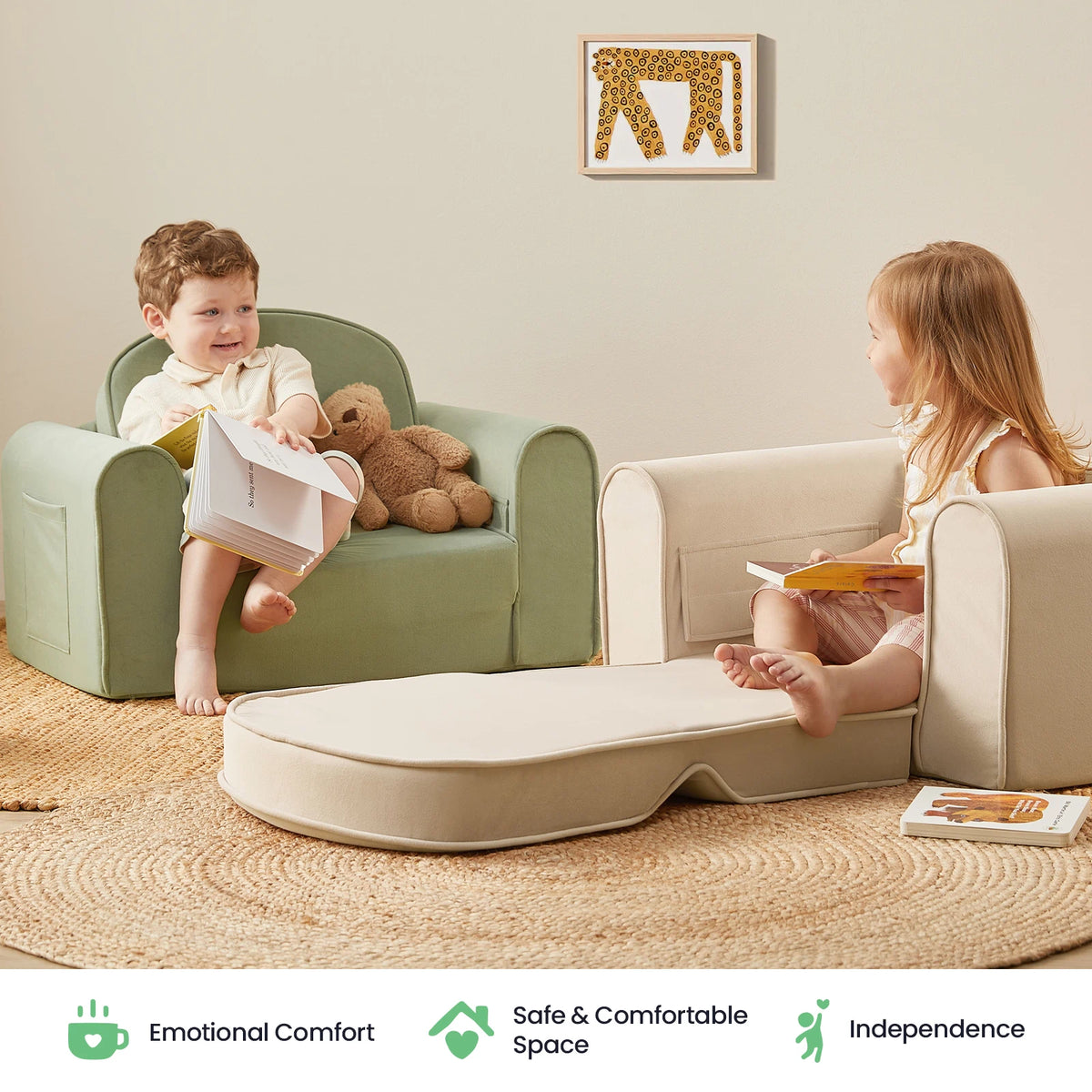 Two young children sit on beige and white Tiny Land® GentleSnug Kid Chairs with books in a cozy room, each enjoying the comfortable support provided by high-density foam. A folded mat lies between them, while a teddy bear rests on one chair. The setting feels warm, inviting, and safe—perfect for story time or relaxing. Icons below showcase the comfort and independence offered by these versatile 2-in-1 kids sofa beds from Tiny Land.