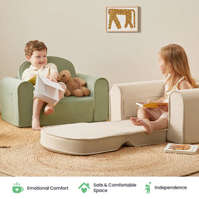 Two young children sit on Tiny Land® GentleSnug Kid Chairs, facing each other with books in a cozy, neutral-toned room. A plush bear and a small canvas featuring a giraffe drawing are visible. The foldable GentleSnug Kid Chair by Tiny Land is crafted from high-density foam, providing comfort and support, while icons below highlight its comfort, safety, and ability to encourage independence.|Beige