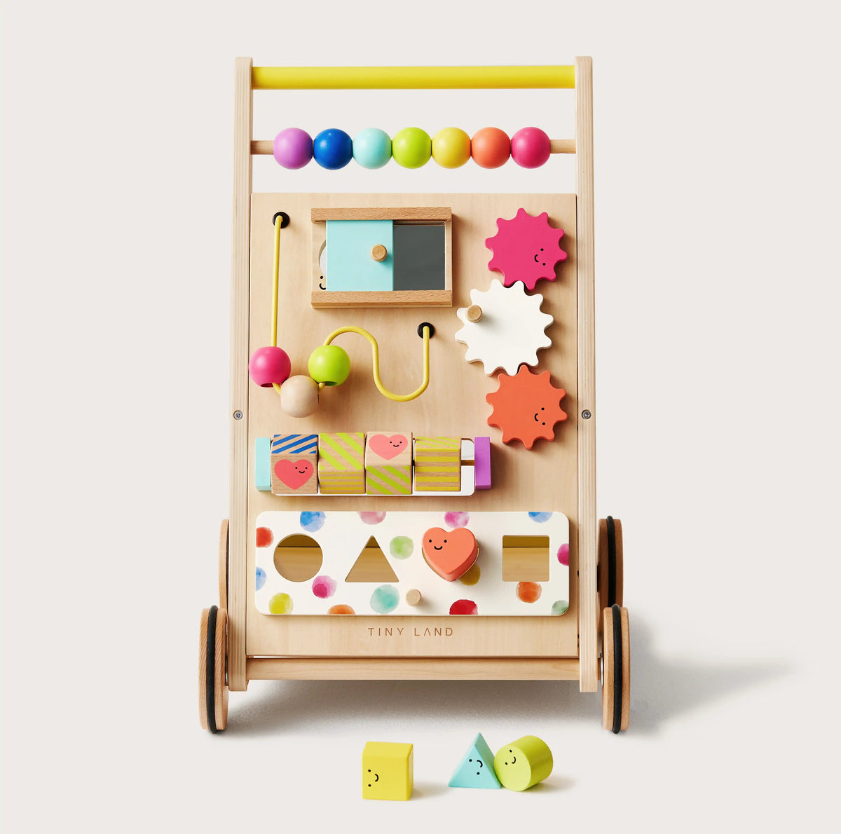 The Tiny Land All-Rounder Baby Playset — Baby Walker + Montessori Box (7-9 Months) features colorful beads, gears, shapes, a bead maze, and shape-sorting holes with a yellow square, blue triangle, and green circle in front of the walker.