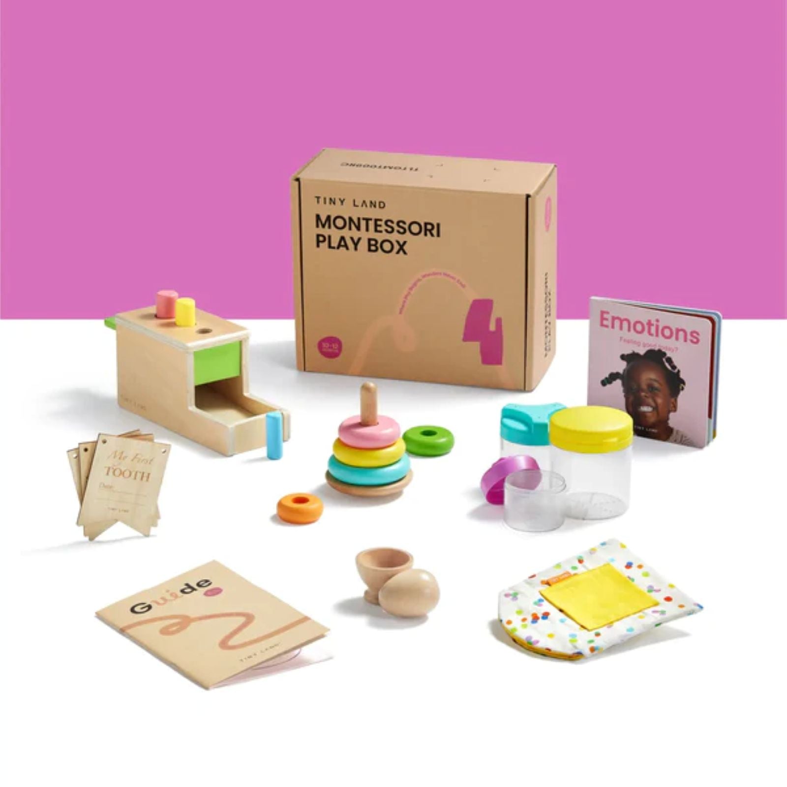 The Tiny Land® Montessori Early Skills Baby Set (7–12 months) by Tiny Land includes Montessori toys: stacking ring, wooden sorting box, cards, guidebook, lidded jars, two eggs, Emotions book, and a yellow cloth.