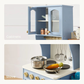 The Tiny Land® Serenity Wooden Kitchen & Coffee Maker by Tiny Land is a blue wooden playset with labeled Cabinets and Stove, including pots, utensils, play corn on the stovetop, and is ideal for pretend play.
