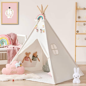 A white Tiny Land® Teepee Tent & PlayNest Climbing Blocks decorated with a rainbow banner, set up in a play corner with a toy mouse, a cloud-shaped cushion, and a rabbit-shaped lamp.