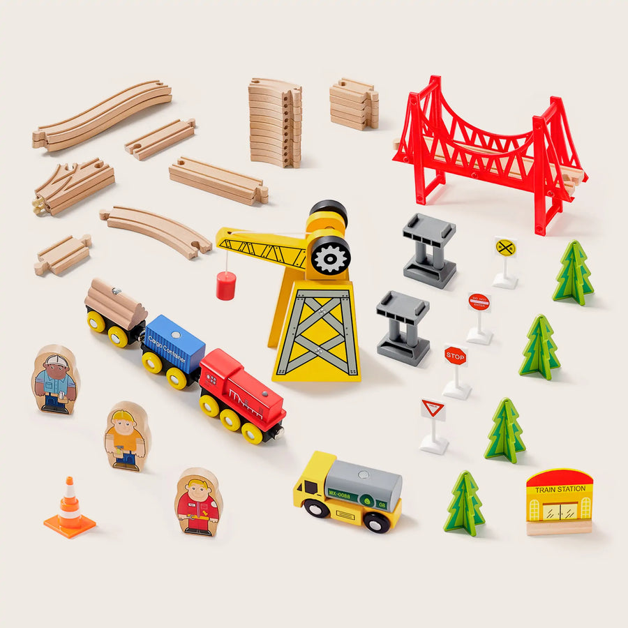 The Tiny Land® Wooden Track Trains 55 Pcs set by Tiny Land features colorful wooden tracks, a red bridge, crane, train cars, vehicles, trees, road signs, people, and a station—all neatly displayed on a light surface.|55 Pcs