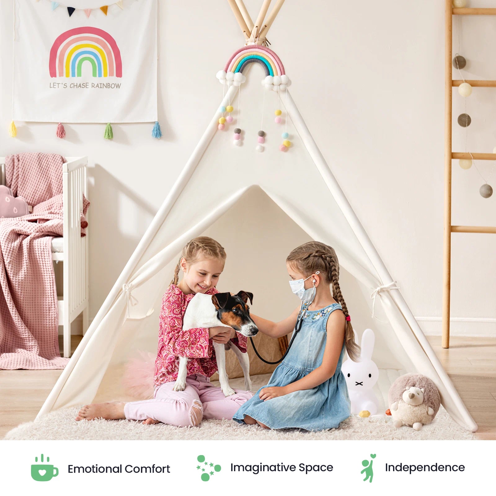 Two young girls sit in the Tiny Land® Teepee Tent for Kids with Mat by Tiny Land, one cradling a small dog. The room glows with rainbow decor and plush stuffed animals. Icons showcase emotional comfort, imaginative play, and independence—making this indoor play tent with floor mat the perfect cozy retreat to inspire creativity and joyful moments for children.
