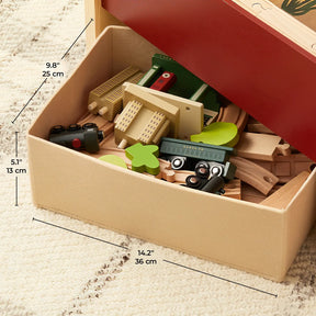 The Tiny Land® 1920 Railway Adventure Train Table by Tiny Land INC comes in a 14.2 x 9.8 x 5.1 in box with wooden tracks, a green train car, small trees, and blocks, all set on a textured cream rug.