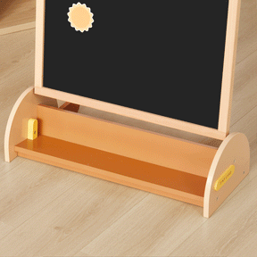 The Tiny Land® Double-Sided Arched Magnet Chalkboard by Tiny Land features a black chalkboard with a sun-shaped magnet, a light brown wooden tray, and stands on a light wood floor—perfect for creative play and learning.