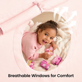 A young child smiles inside the Tiny Land® Kids Bed Tent, playing with pink toy vehicles near its round breathable window. White arrows show airflow. Text reads: Breathable Windows for Comfort.|Pink