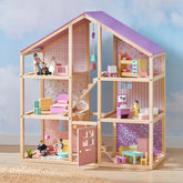 The Tiny Land® Sweetwood Unicorn Dollhouse by Tiny Land features three floors, pastel furniture, pink and purple walls, a bedroom, bathroom, kitchen, living room, balcony, and four poseable wooden dolls in different rooms.