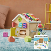 A Tiny Land Brain & Hands Playset—Montessori Box (4–6 Months) + Activity Cube features a colorful wooden cube with shapes, xylophone, bead maze, and smiley blocks on a blue rug. Inset: kit showing toys and educational materials.