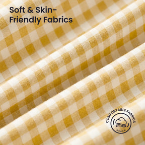 Close-up of yellow and white gingham fabric from the Tiny Land® Kids Tent by Tiny Land INC, featuring "Soft & Skin-Friendly Fabrics" text and a "Comfortable Fabrics" icon with a cloud and fabric graphic.