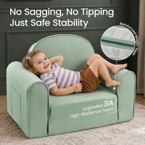 A smiling young child relaxes on the Tiny Land® GentleSnug Kids Sofa Chair, a light green toddler armchair by Tiny Land, featuring highlighted text about its stability, upgraded foam, and reinforced magic tape. The flip-open chair is set in a cozy room with dark walls and a beige rug.|Light Green