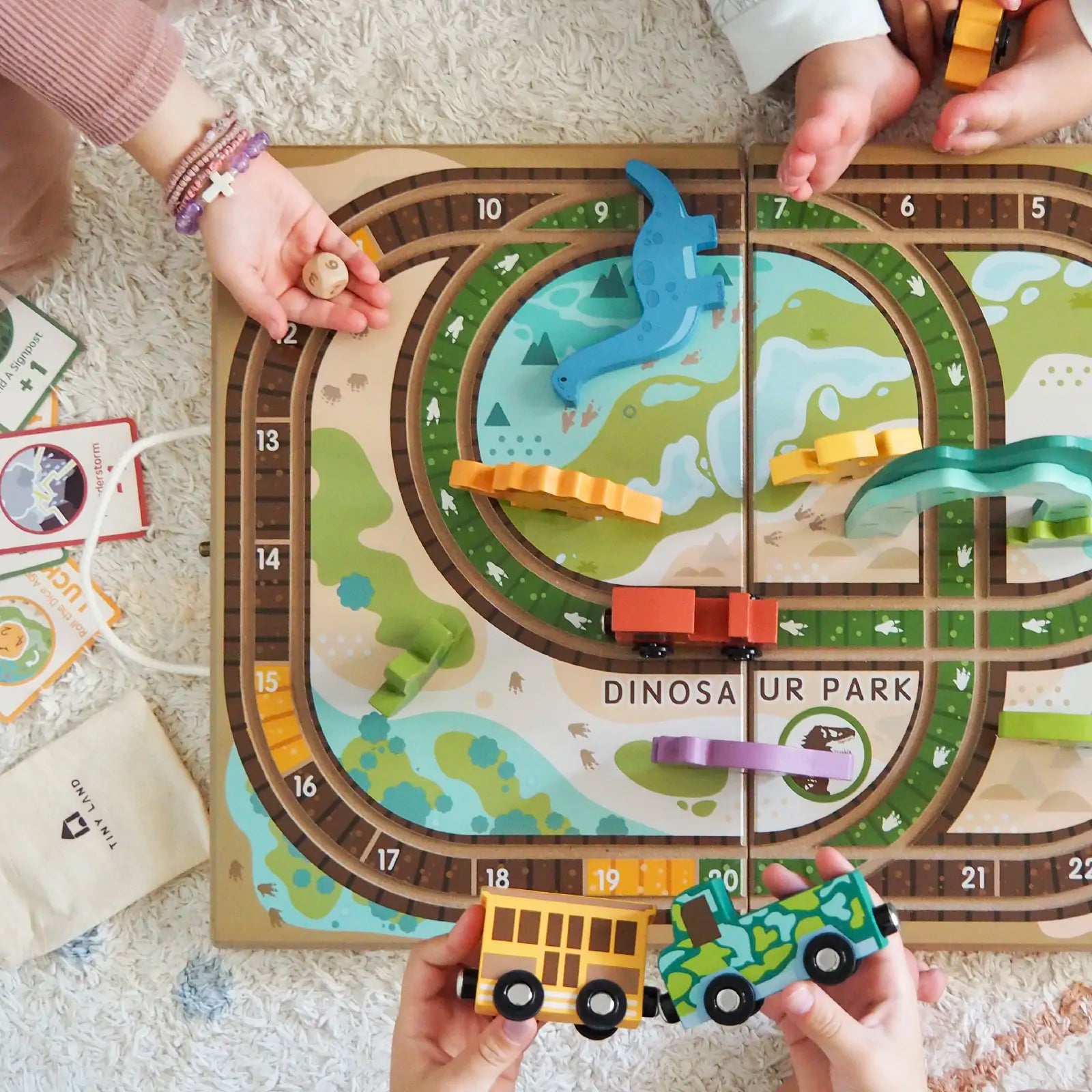 Tiny Land® Dinosaurs Wooden Take-Along Tabletop Train Set