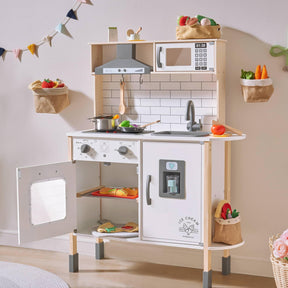 The Tiny Land® Farm-to-Table Gift Set features a light & sound kitchen with stove, oven, sink, and microwave. It includes play food, utensils, pots, fabric baskets with toy veggies—perfect for kids’ pretend play.