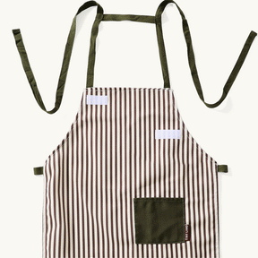 A stylish Tiny Land® BistroSwitch Play Kitchen apron with brown and white stripes, olive green pocket, and matching ties from Tiny Land, perfect for pretend play or as a chic addition to your play kitchen accessories.|Green